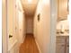 Hallway features wood flooring and white doors leading to various rooms at 208 Owens Dr, Summerville, SC 29485