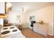 Cozy eat-in kitchen with wood floors, a dining table, and ample counter space at 208 Owens Dr, Summerville, SC 29485