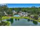 Scenic aerial view of the neighborhood with the community pool and tranquil pond at 215 Angora Way, Summerville, SC 29485