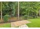 A backyard patio with a fence and a view of many trees at 215 Angora Way, Summerville, SC 29485