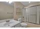 Bathroom with white cabinets, chrome fixtures, glass shelving and shower/tub combo at 215 Angora Way, Summerville, SC 29485