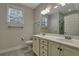 Well-lit bathroom with double vanity, tile floor, and large mirror at 215 Angora Way, Summerville, SC 29485