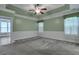 Spacious bedroom with a tray ceiling, ceiling fan, and large windows with lots of light at 215 Angora Way, Summerville, SC 29485