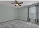 Neutral bedroom features a large window with natural light and grey carpet at 215 Angora Way, Summerville, SC 29485