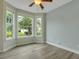 Inviting bedroom with plenty of natural light, light grey walls, and modern wood flooring at 215 Angora Way, Summerville, SC 29485