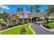 Attractive brick clubhouse featuring an arched entryway and manicured landscaping at 215 Angora Way, Summerville, SC 29485