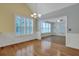 Dining area with bright windows, plantation shutters, wood floors and decorative wainscoting at 215 Angora Way, Summerville, SC 29485