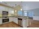 Bright kitchen with stainless steel appliances, granite countertops and stylish pendant lighting at 215 Angora Way, Summerville, SC 29485