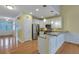 Open concept kitchen with stainless steel appliances, granite counters, and white cabinetry at 215 Angora Way, Summerville, SC 29485