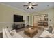 Living room with tile floors, nice furniture, a ceiling fan and an archway to the dining room at 215 Angora Way, Summerville, SC 29485