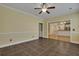 Living room with tile floors, a ceiling fan and an archway to the dining room at 215 Angora Way, Summerville, SC 29485