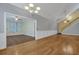 Spacious living area with hardwood flooring, open to a dining area and staircase at 215 Angora Way, Summerville, SC 29485