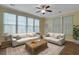 Bright sun room with tile floors, comfortable furniture and a ceiling fan at 215 Angora Way, Summerville, SC 29485