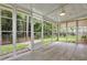 A sunroom with tile flooring, a ceiling fan, and views of the backyard at 215 Angora Way, Summerville, SC 29485