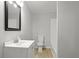 Bathroom featuring a white vanity, commode, and tub/shower combination at 2460 Surprise St, North Charleston, SC 29405