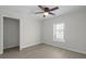 Bedroom featuring wood-look flooring, a ceiling fan, and closet access at 2460 Surprise St, North Charleston, SC 29405