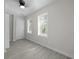 Bedroom with two bright windows, wood-look flooring and a standard closet at 2460 Surprise St, North Charleston, SC 29405