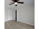Bedroom featuring wood-look flooring, a ceiling fan, and closet access at 2460 Surprise St, North Charleston, SC 29405