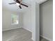 Bedroom with light gray walls, wood-look flooring, and bright window at 2460 Surprise St, North Charleston, SC 29405