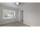 Neutral bedroom with a window, wood-look floors and fresh white trim at 2460 Surprise St, North Charleston, SC 29405