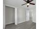 Bedroom featuring a ceiling fan, closet, and wood-look flooring at 2460 Surprise St, North Charleston, SC 29405