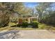 This well-maintained brick home has a cozy front porch and mature landscaping, creating an inviting curb appeal at 2460 Surprise St, North Charleston, SC 29405