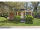 Charming brick home featuring a cozy porch and manicured front lawn, perfect for comfortable suburban living at 2460 Surprise St, North Charleston, SC 29405