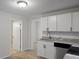 Bright kitchen with white cabinets, stainless steel appliances and stone countertops at 2460 Surprise St, North Charleston, SC 29405