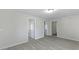 Bright living room with light gray walls, modern gray floors, and white trim for a clean, updated look at 2460 Surprise St, North Charleston, SC 29405