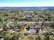 Aerial view showcasing neighborhood and proximity to a tranquil waterway and lush trees at 2467 Birkenhead Dr, Charleston, SC 29414