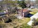 Backyard aerial view showcasing a brick home, patio, and storage shed at 2467 Birkenhead Dr, Charleston, SC 29414