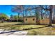 View of backyard showcasing two sheds and lush grass, highlighting outdoor storage options at 2467 Birkenhead Dr, Charleston, SC 29414