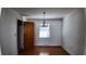 Cozy dining room featuring hardwood floors, a chandelier, and a large window at 2467 Birkenhead Dr, Charleston, SC 29414