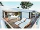 Exterior deck with lounge chairs, seating area, and water views at 304 Carolina Blvd, Isle of Palms, SC 29451