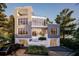 Striking modern home featuring large windows, clean lines, and a two-car garage at 304 Carolina Blvd, Isle of Palms, SC 29451