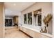 Bright hallway with hardwood floors, recessed lighting, custom cabinets, and indoor plants at 304 Carolina Blvd, Isle of Palms, SC 29451