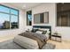 Stylish main bedroom with large windows and a comfortable bed at 304 Carolina Blvd, Isle of Palms, SC 29451