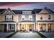 Attractive townhome design with a cozy porch and well-manicured front yard, creating a warm and inviting entrance at 314 Green Fern Dr, Summerville, SC 29483