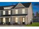 Inviting townhome featuring a classic porch design, perfect for enjoying the outdoors in a comfortable setting at 314 Green Fern Dr, Summerville, SC 29483