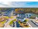 Beautiful aerial view of a neighborhood, highlighting the well-planned community and serene pond at 316 Green Fern Dr, Summerville, SC 29483