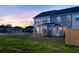 A spacious backyard provides a serene outdoor space with lush grass, patio, and privacy fencing at 316 Green Fern Dr, Summerville, SC 29483