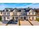 Charming townhomes with manicured lawns, driveways, and welcoming front porches create an inviting curb appeal at 316 Green Fern Dr, Summerville, SC 29483