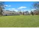 Large, grassy backyard with main house and additional outbuilding visible at 3564 Blanding Dr, Johns Island, SC 29455