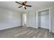 Bedroom with light gray walls, ceiling fan, closet, and modern flooring throughout at 3564 Blanding Dr, Johns Island, SC 29455