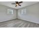 Bedroom featuring gray walls, modern flooring, ceiling fan, and windows providing natural light at 3564 Blanding Dr, Johns Island, SC 29455
