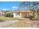 View of house and covered carport with a well-maintained yard and landscaping at 3564 Blanding Dr, Johns Island, SC 29455