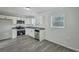 Renovated kitchen boasts stainless appliances, granite counters, and ample cabinet space at 3564 Blanding Dr, Johns Island, SC 29455