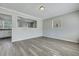 Bright open living room with view of the kitchen and new laminate flooring at 3564 Blanding Dr, Johns Island, SC 29455