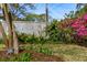 Backyard featuring blossoming plants, plush grass, a privacy fence, and landscaping at 4 St Teresa Dr, Charleston, SC 29407
