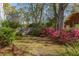 Beautiful backyard with a privacy fence and mature foliage at 4 St Teresa Dr, Charleston, SC 29407